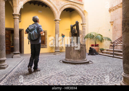 Mature tourist in Casa de Colon (Columbus` house) museum in Las Palmas, Gran Canaria, Canary Islands, Spain Stock Photo